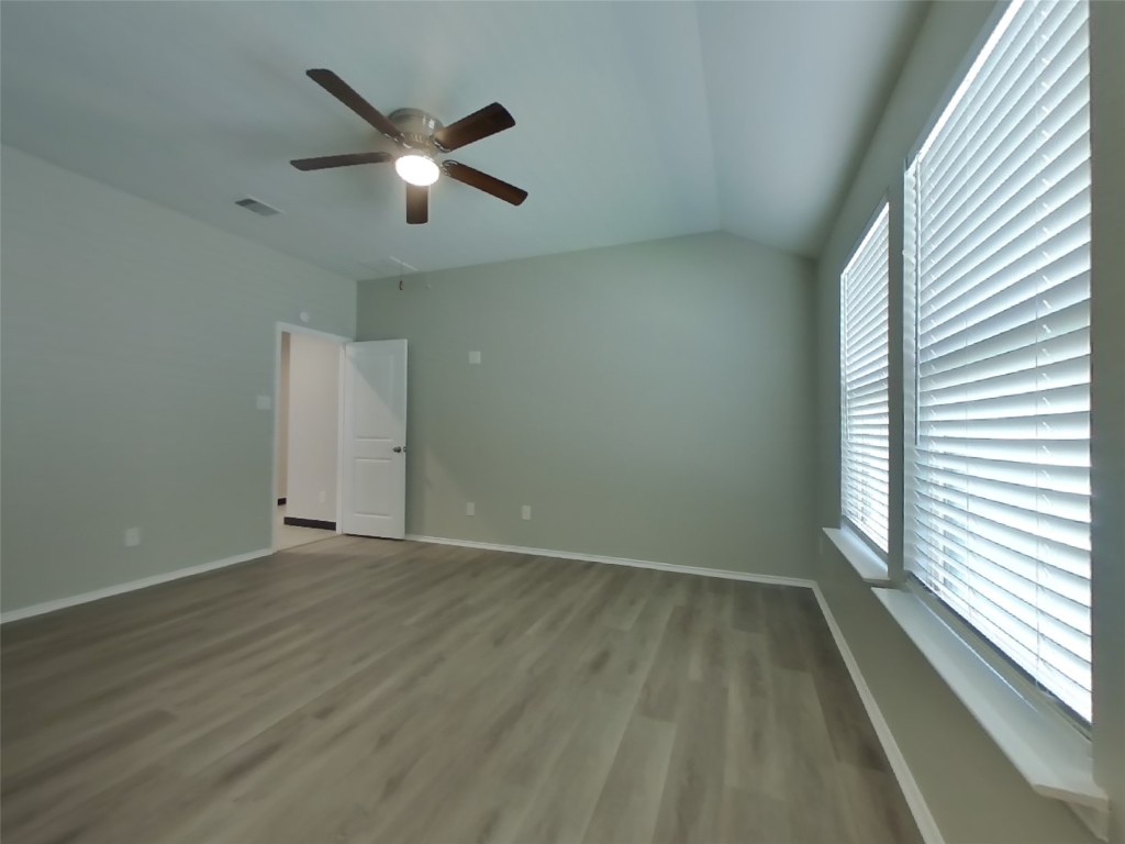 8523 Aster Glen Way Rosharon, TX 77583 - Photo 7 of 15 wooden floor in an empty room with a window