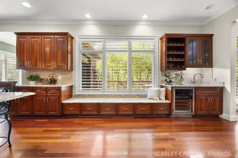 a view of a dining room with furniture wooden floor and a chandelier