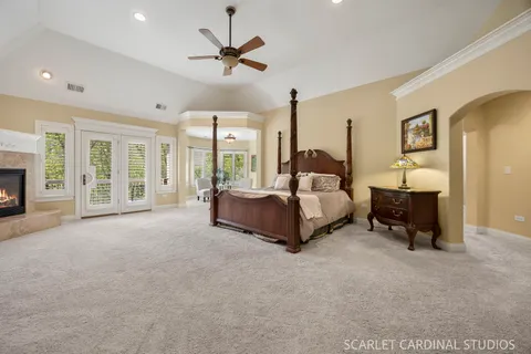 a large bathroom with a glass door shower and sink