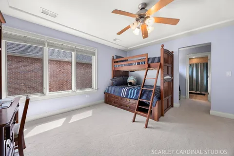 a living room with furniture a flat screen tv and a large window