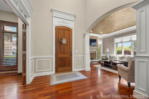 a living room with furniture window and wooden floor