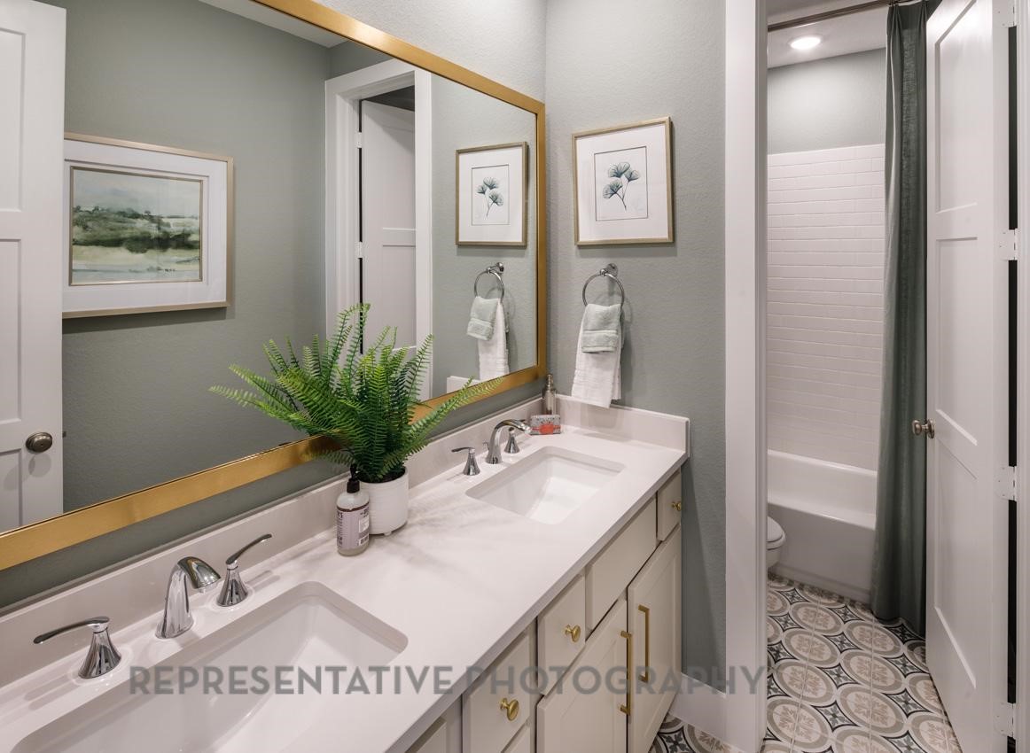 13048 Wandering Rdg Lane Conroe, TX 77302 - Photo 13 of 49 a bathroom with a sink and a mirror