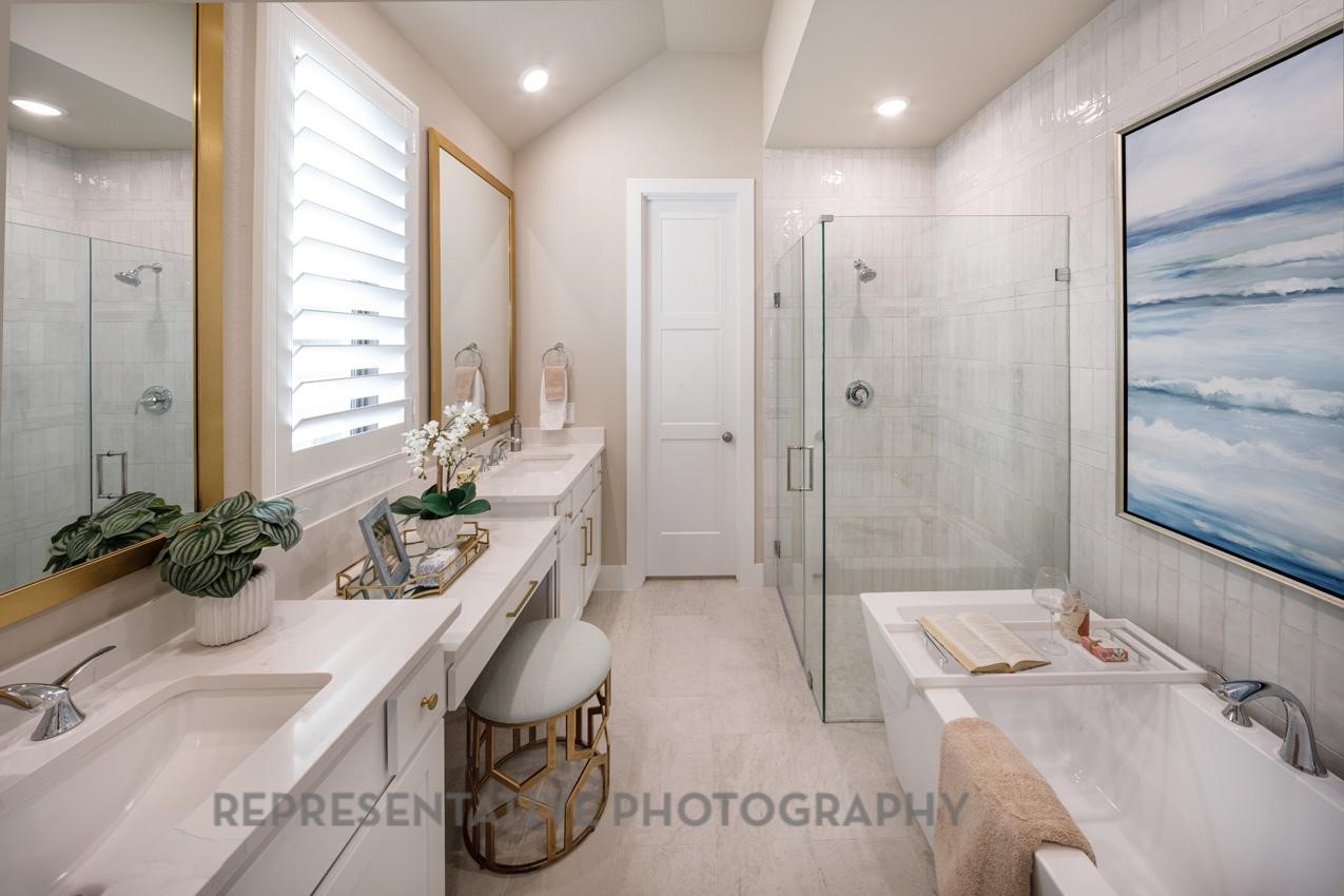 13048 Wandering Rdg Lane Conroe, TX 77302 - Photo 14 of 49 a bathroom with a tub sink and mirror