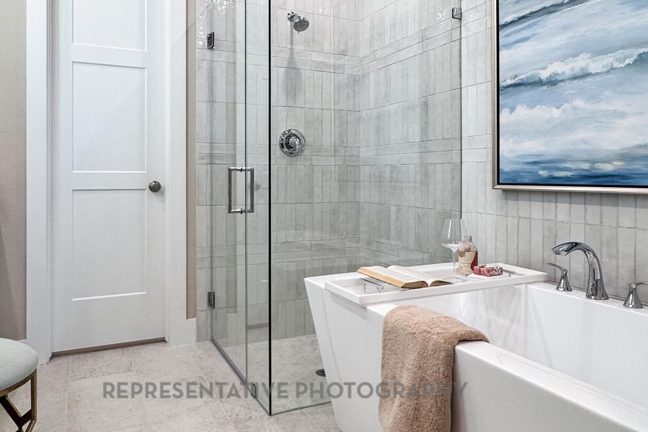13048 Wandering Rdg Lane Conroe, TX 77302 - Photo 16 of 49 a bathroom with a sink and a shower