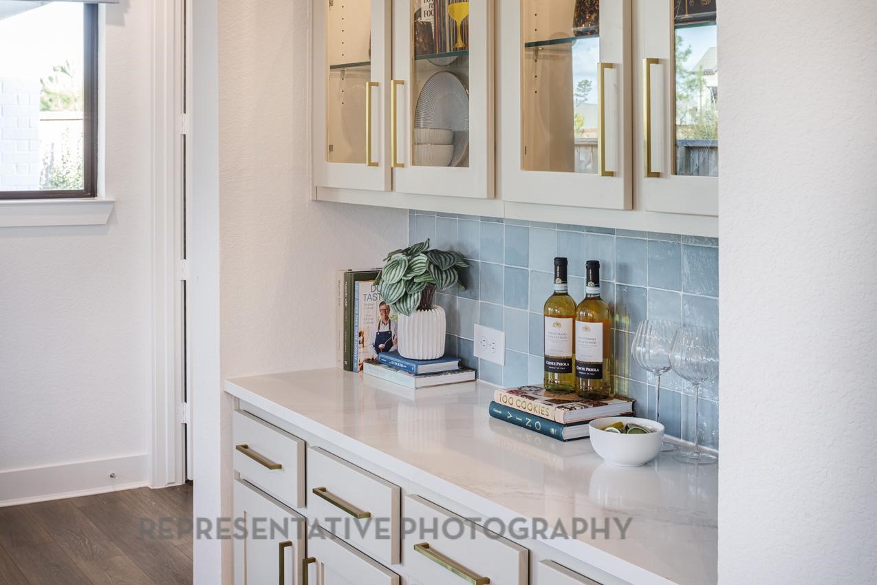 13048 Wandering Rdg Lane Conroe, TX 77302 - Photo 22 of 49 a kitchen with sink refrigerator and window