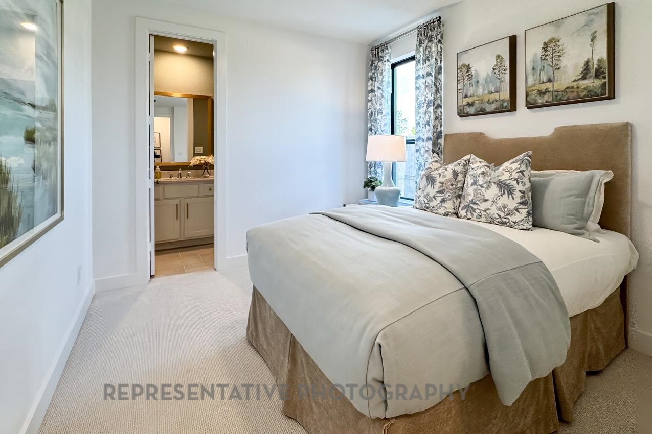 13048 Wandering Rdg Lane Conroe, TX 77302 - Photo 25 of 49 a spacious bedroom with a bed and cabinets