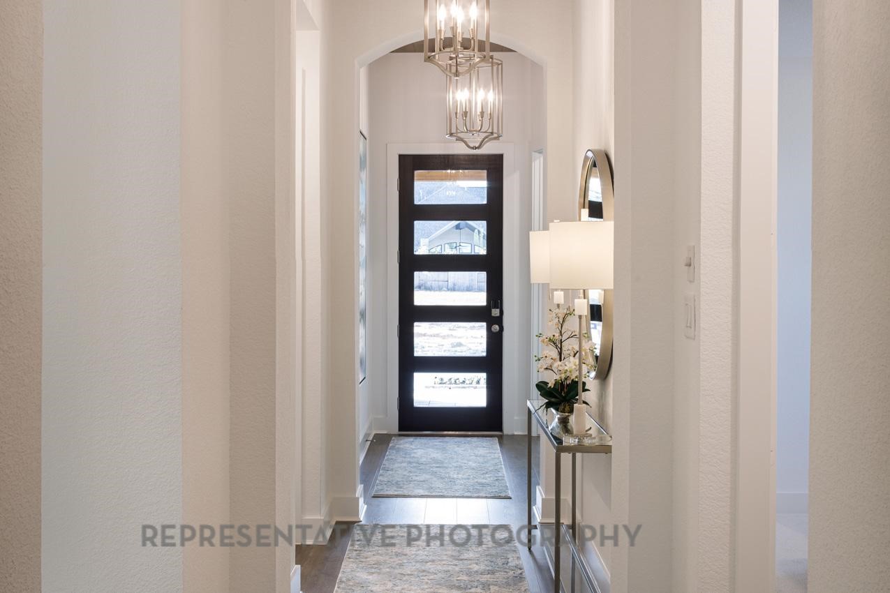 13048 Wandering Rdg Lane Conroe, TX 77302 - Photo 29 of 49 a view of livingroom form hallway