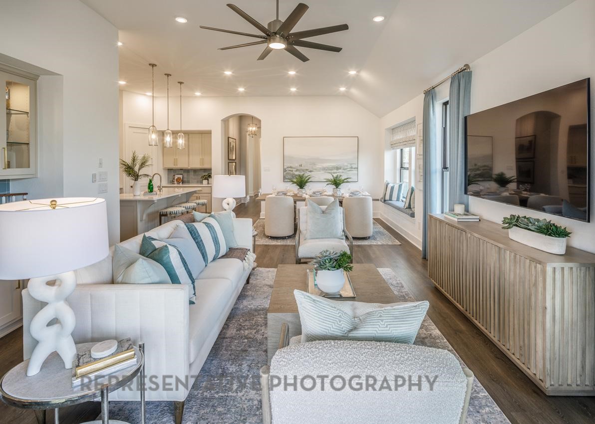 13048 Wandering Rdg Lane Conroe, TX 77302 - Photo 8 of 49 a living room with furniture and a flat screen tv