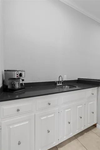 a view of a dining room with furniture and a window