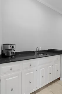 a view of a dining room with furniture and a window