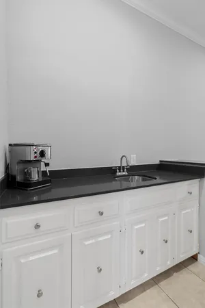 a view of a dining room with furniture and a window