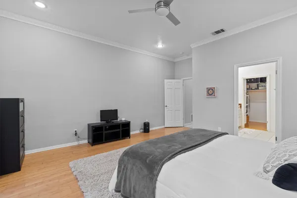 a bed room with a bed and a dresser