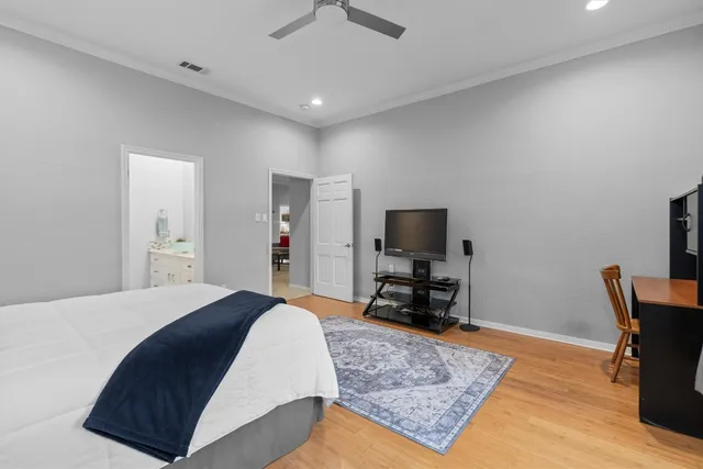 a bedroom with furniture and a rug