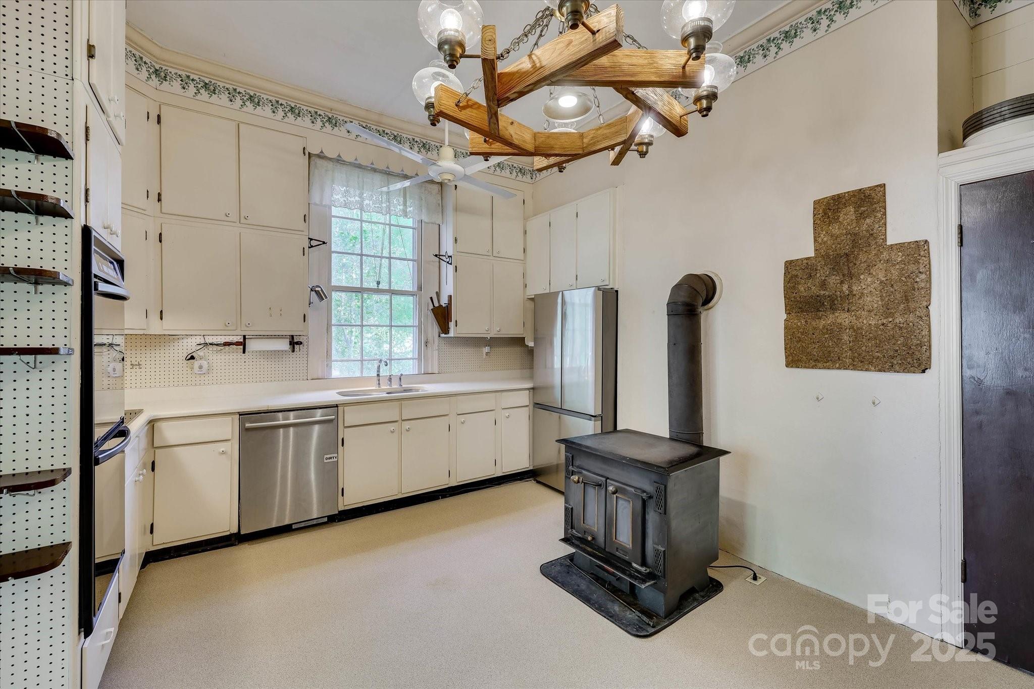621 Meeting Street Road Edgefield, SC 29824 - Photo 14 of 40 a kitchen with refrigerator and cabinets