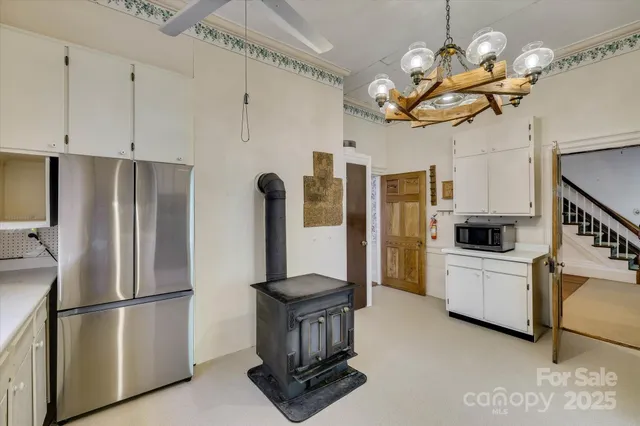 a kitchen with cabinets and stainless steel appliances