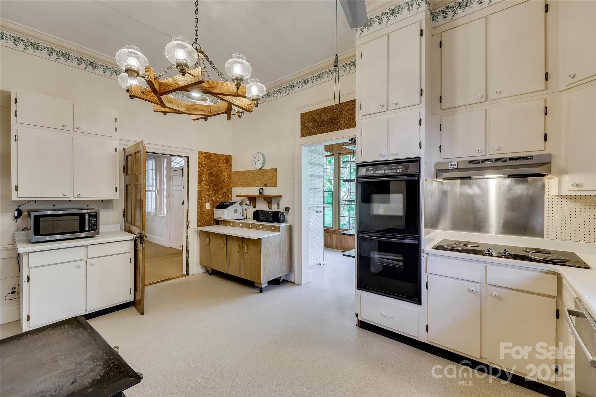 621 Meeting Street Road Edgefield, SC 29824 - Photo 16 of 40 a kitchen with cabinets and stainless steel appliances