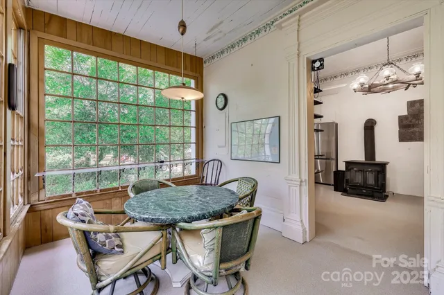 a living room with furniture and a dresser