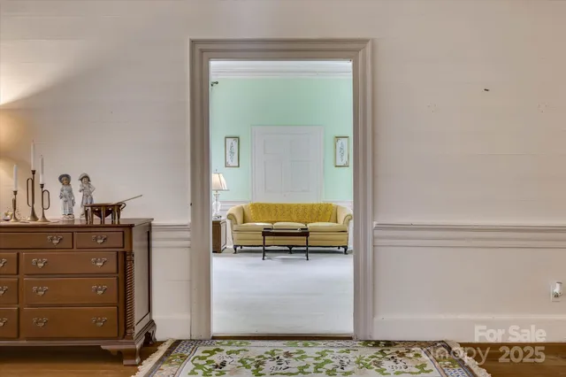 a living room with furniture and a lamp