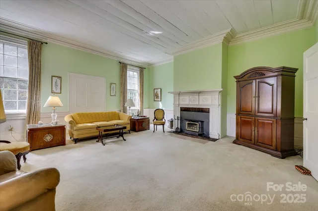 a spacious bedroom with a bed and a fireplace