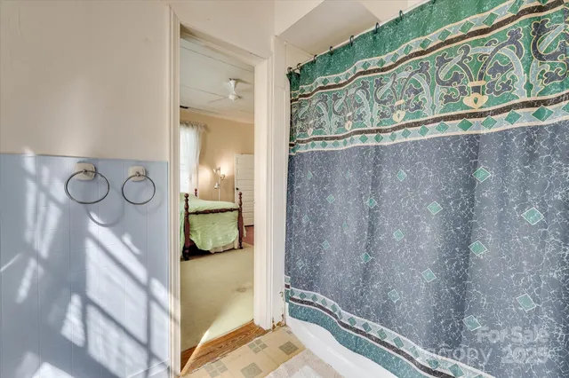 a bedroom with windows