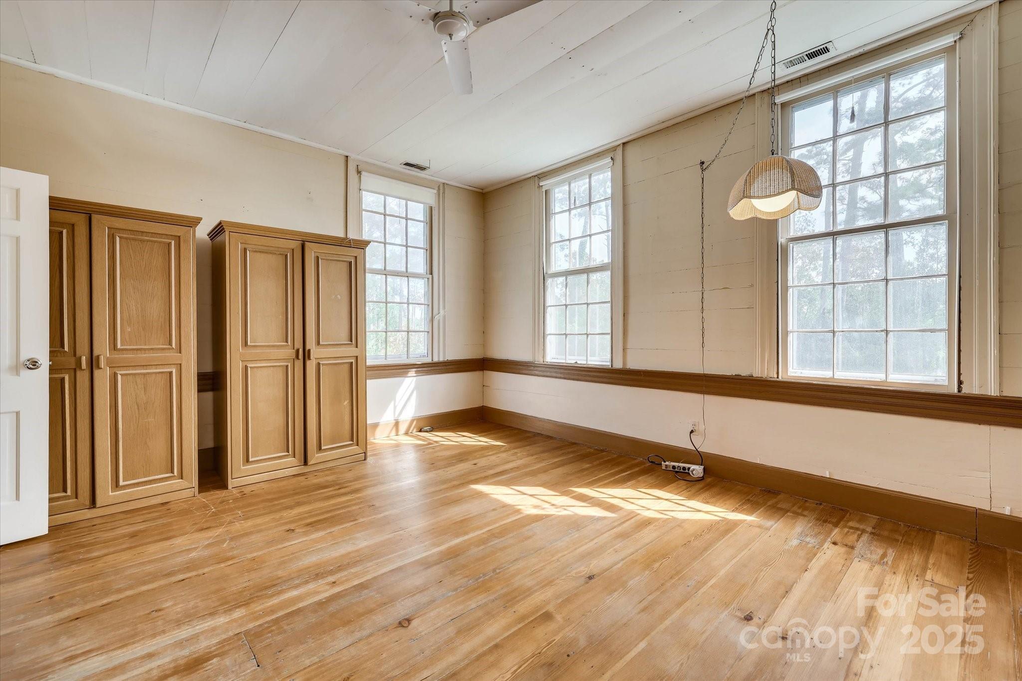 621 Meeting Street Road Edgefield, SC 29824 - Photo 30 of 40 a view of an empty room with wooden floor and a window