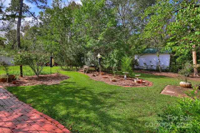 a view of a house with a tree