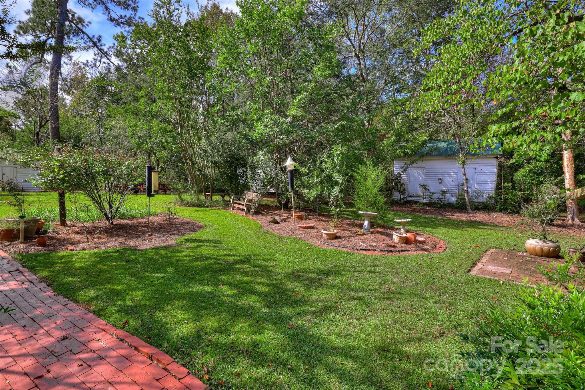 621 Meeting Street Road Edgefield, SC 29824 - Photo 37 of 40 a view of a backyard with a garden