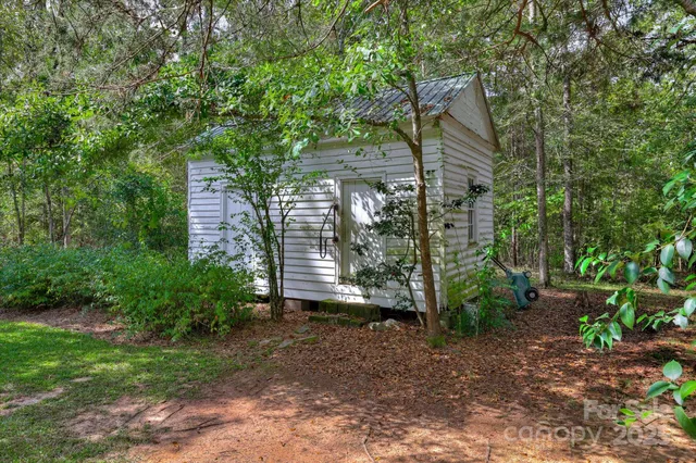 a picture of a bathroom with a refrigerator