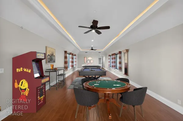 a kitchen with stainless steel appliances granite countertop a sink a stove and a refrigerator