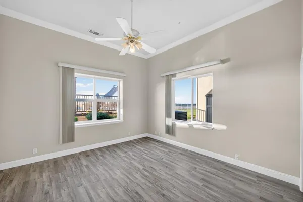 a kitchen with stainless steel appliances granite countertop a sink a counter top space and living room view