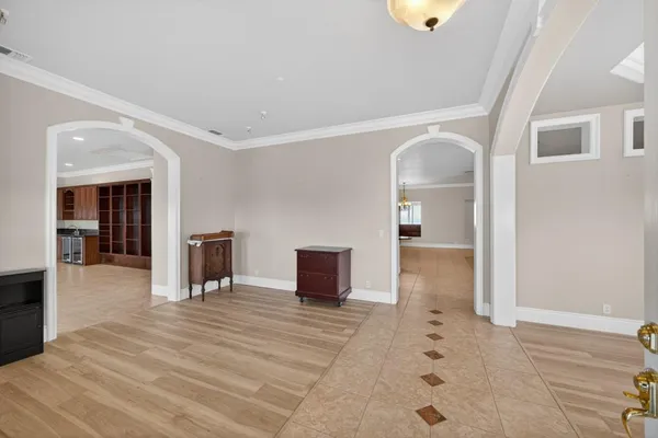 a kitchen with granite countertop a sink and cabinets