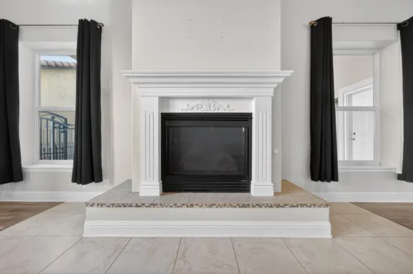 a kitchen with stainless steel appliances granite countertop a refrigerator a stove and a sink