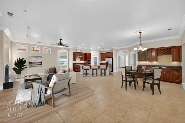 a living room with furniture a flat screen tv and a large window