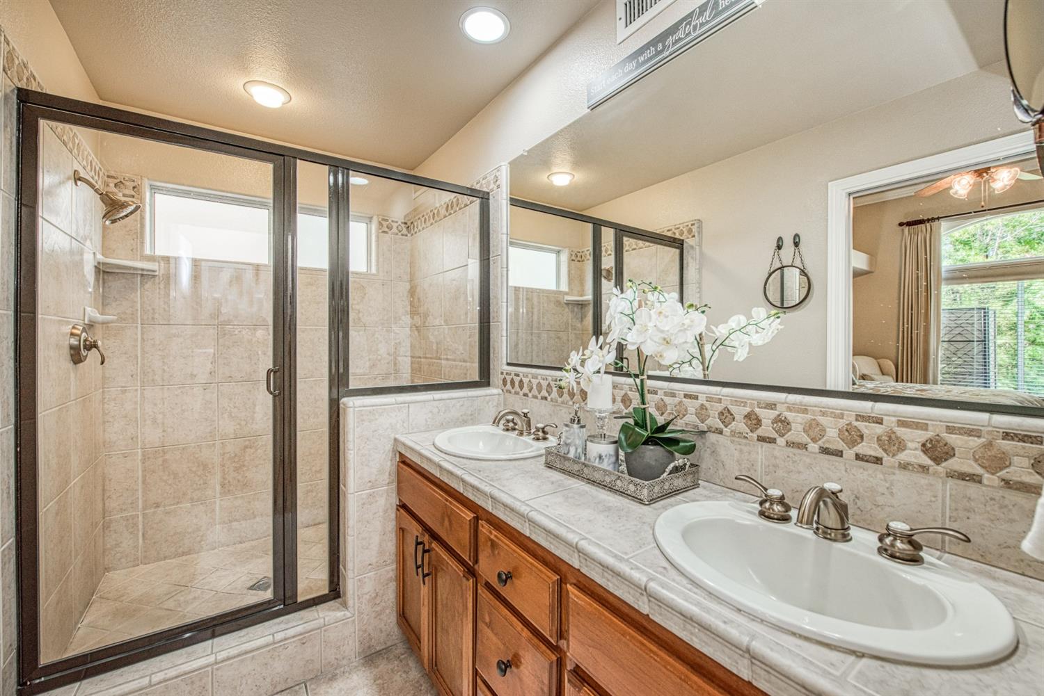 2815 Isabel Avenue Clovis, CA 93611 - Photo 19 of 31 Gorgeous master bathroom w/dual basins, large tile shower and alder cabinets.