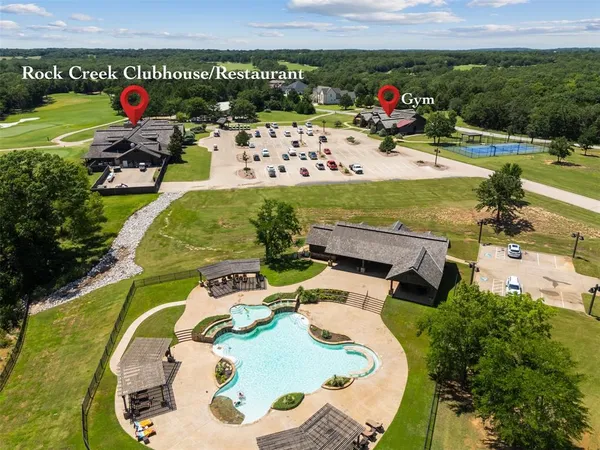an aerial view of a house with outdoor space