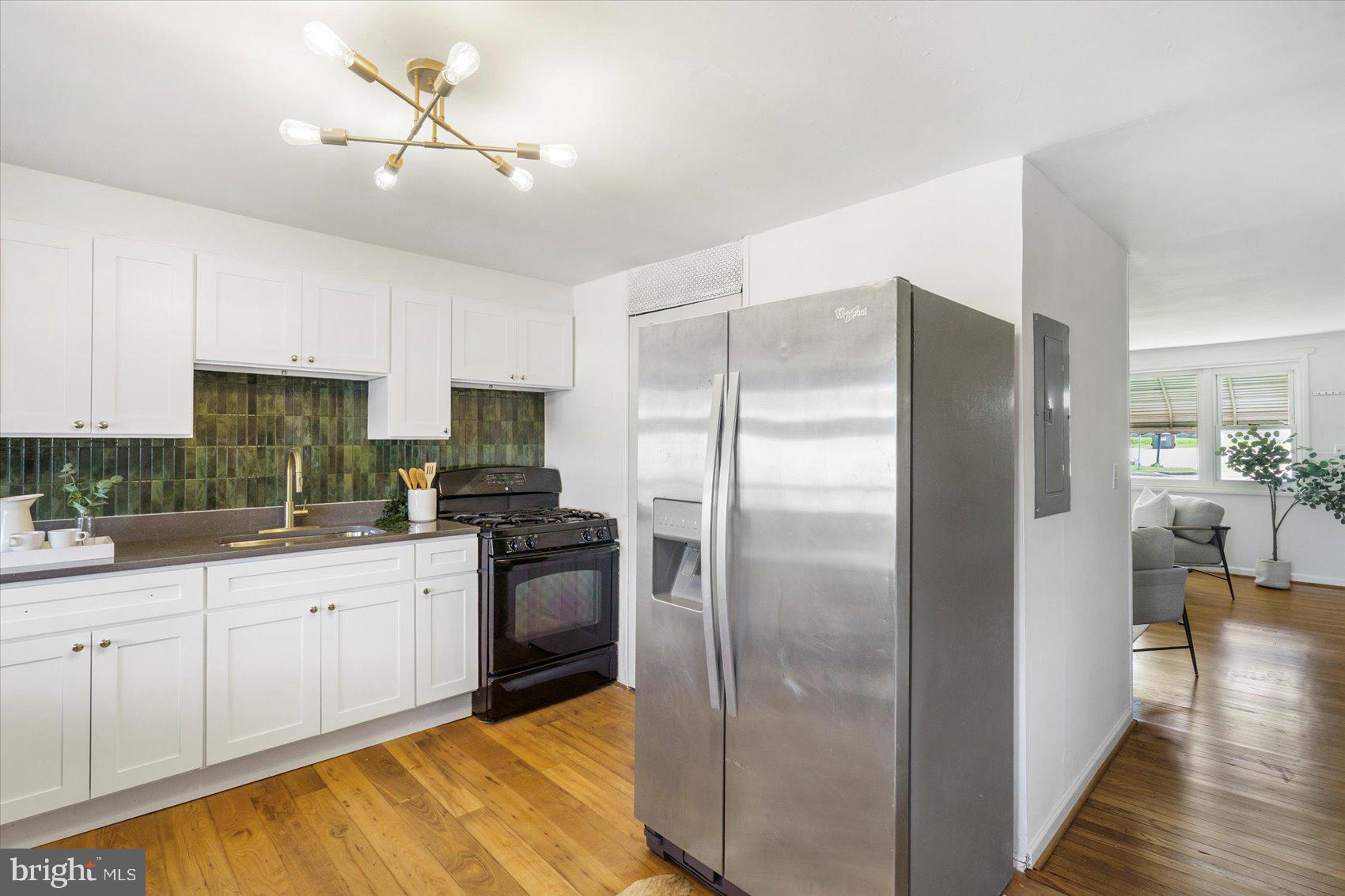 4430 Annapolis Road Halethorpe, MD 21227 - Photo 13 of 23 a kitchen with a refrigerator and a sink