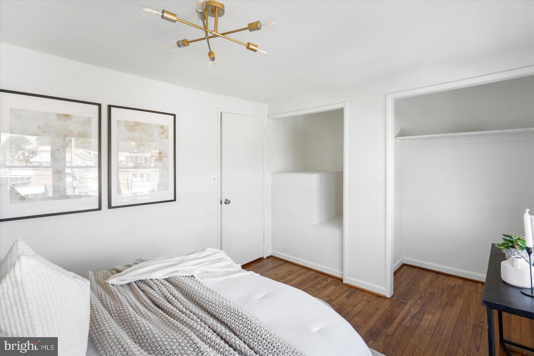4430 Annapolis Road Halethorpe, MD 21227 - Photo 15 of 23 a bedroom with a bed and wooden floor