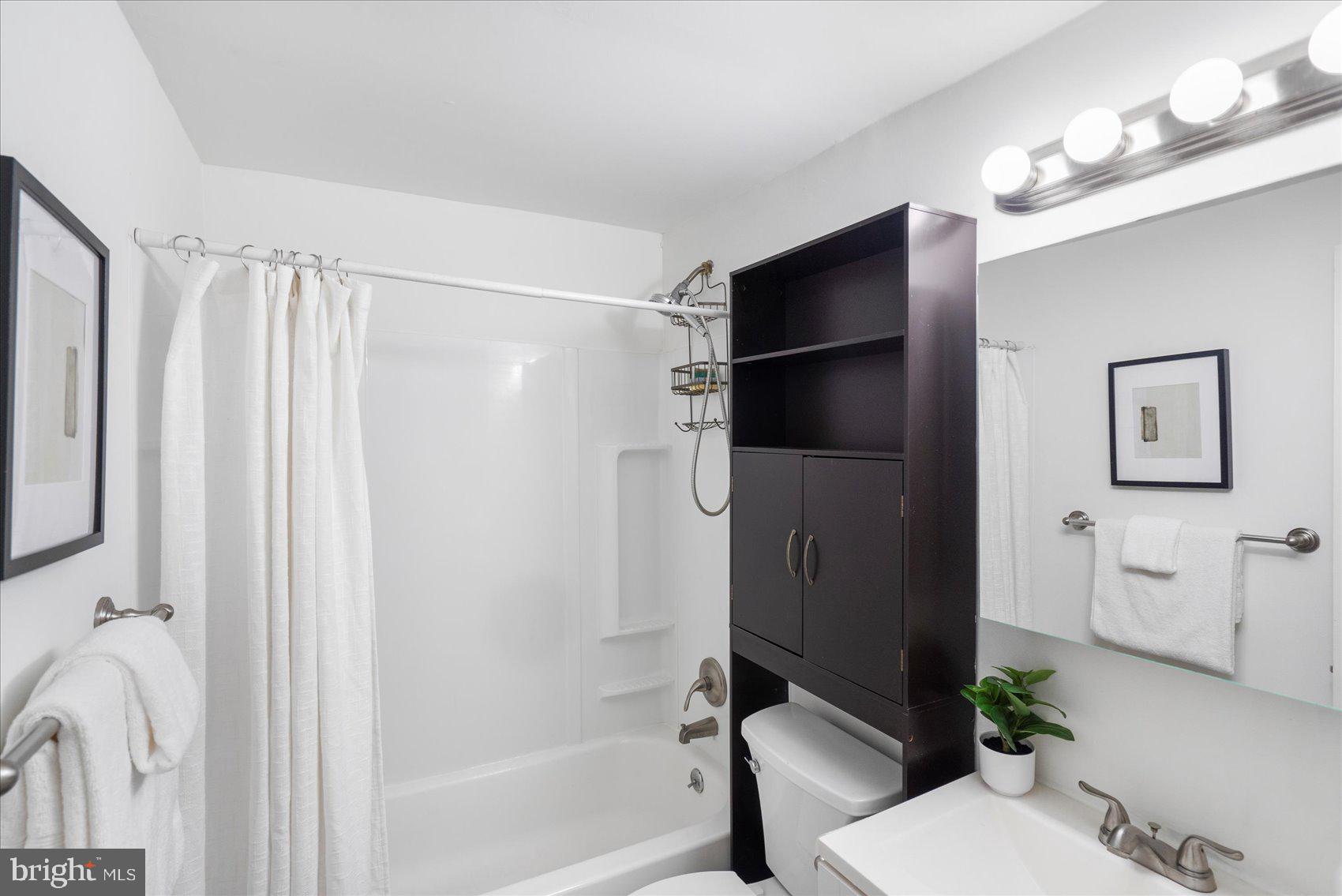 4430 Annapolis Road Halethorpe, MD 21227 - Photo 16 of 23 a bathroom with a shower and a toilet