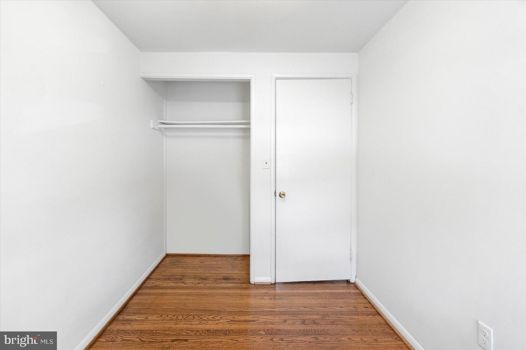 4430 Annapolis Road Halethorpe, MD 21227 - Photo 19 of 23 a view of an empty room with wooden floor