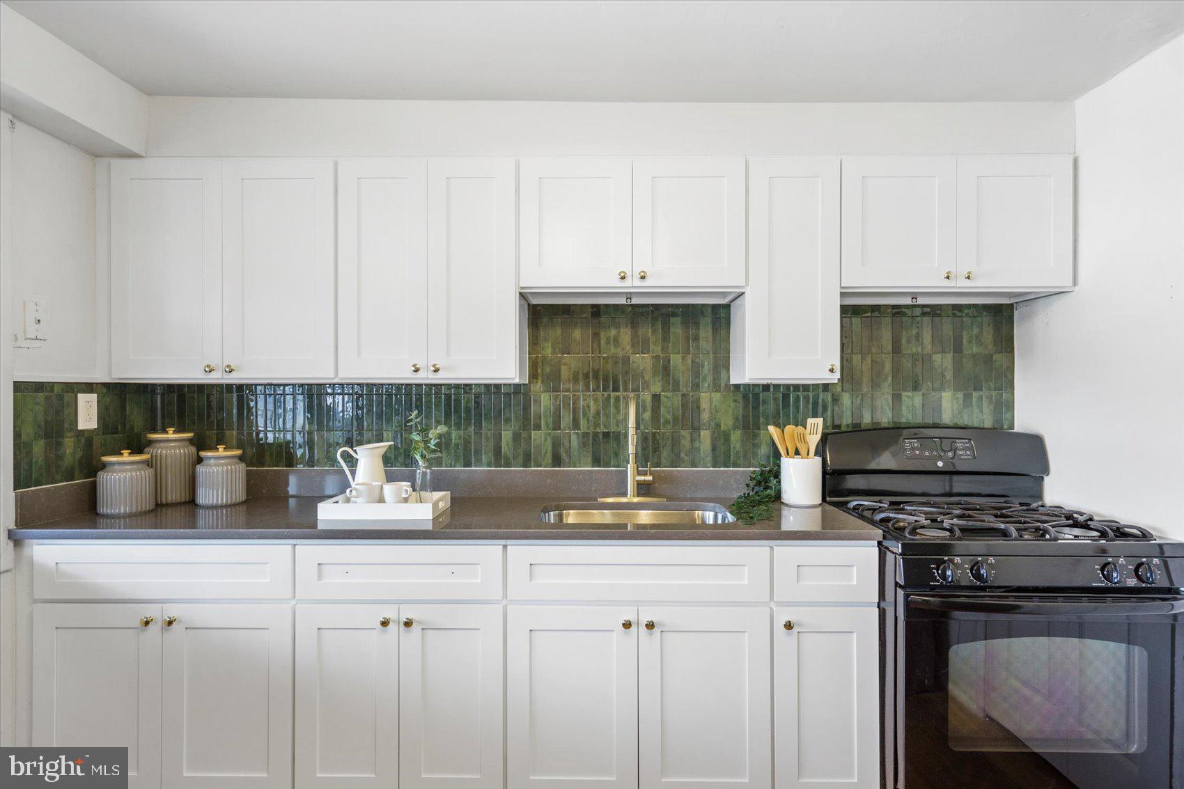 4430 Annapolis Road Halethorpe, MD 21227 - Photo 2 of 23 a kitchen with a stove and cabinets