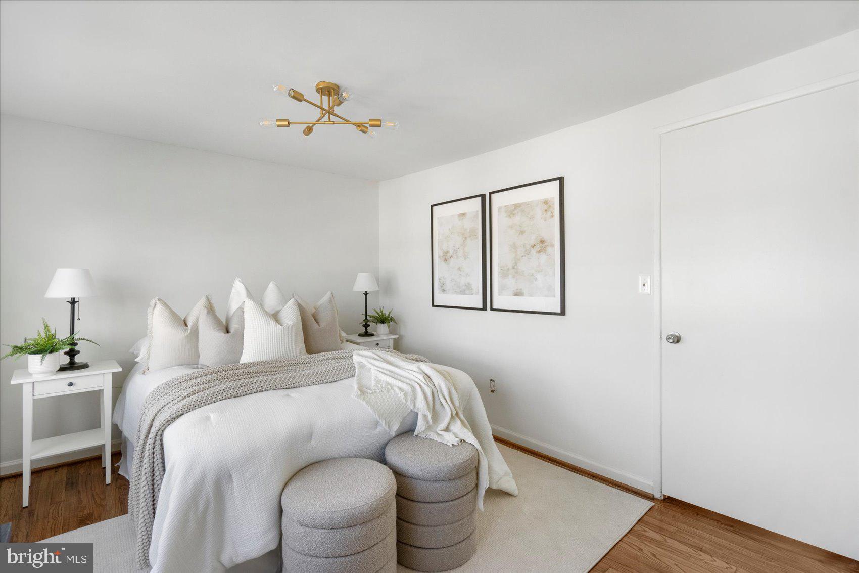 4430 Annapolis Road Halethorpe, MD 21227 - Photo 3 of 23 a bedroom with a bed and a chandelier