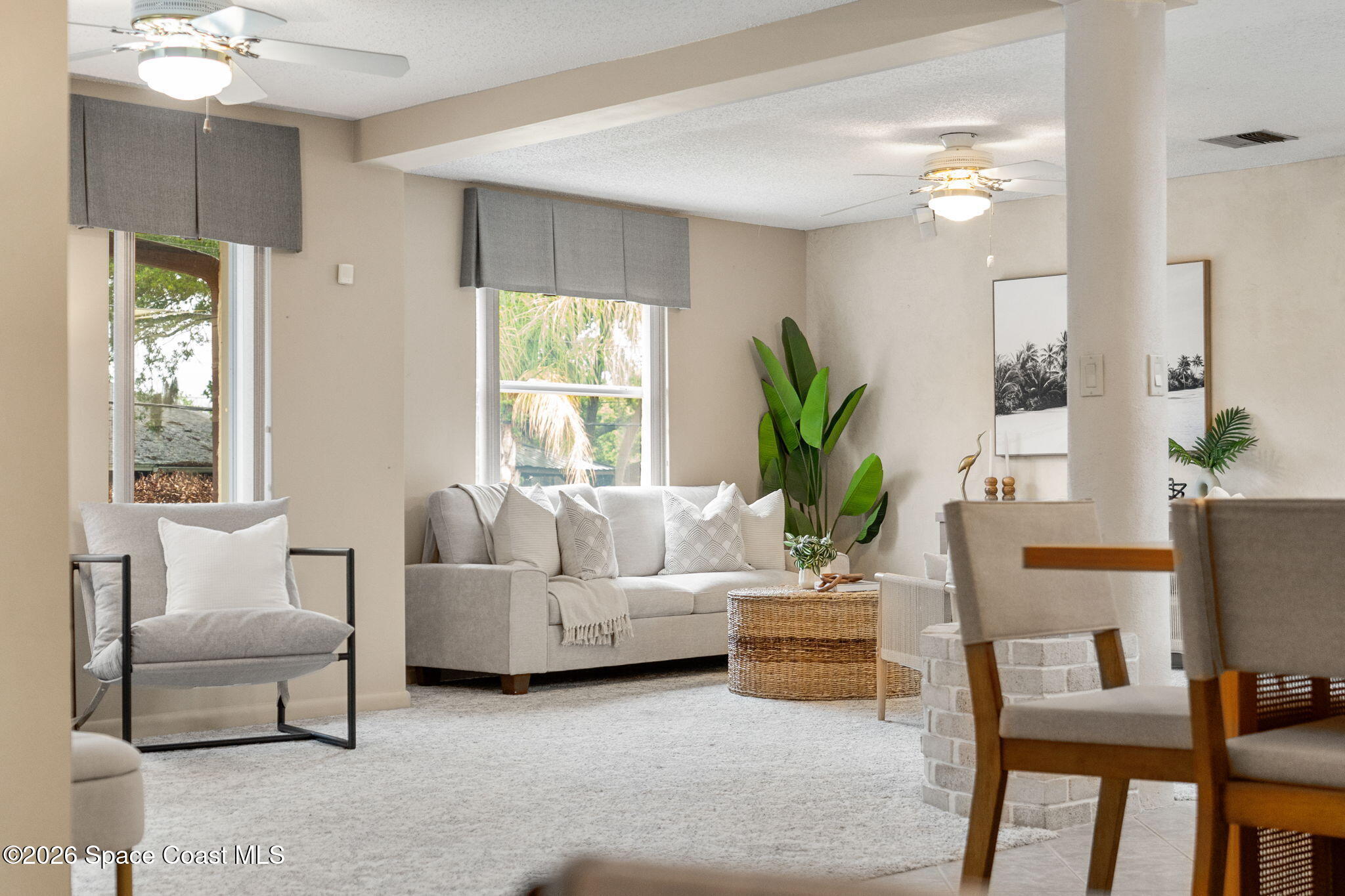 1310 St George Road Merritt Island, FL 32952 - Photo 25 of 59 a living room with furniture and a large window