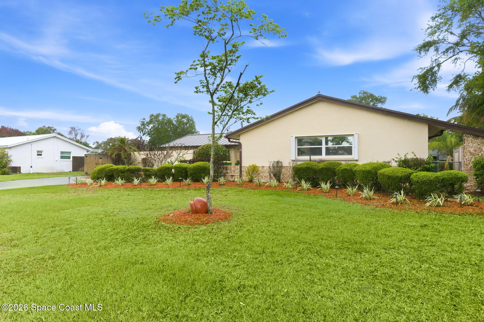 1310 St George Road Merritt Island, FL 32952 - Photo 3 of 59 a front view of house with yard and green space