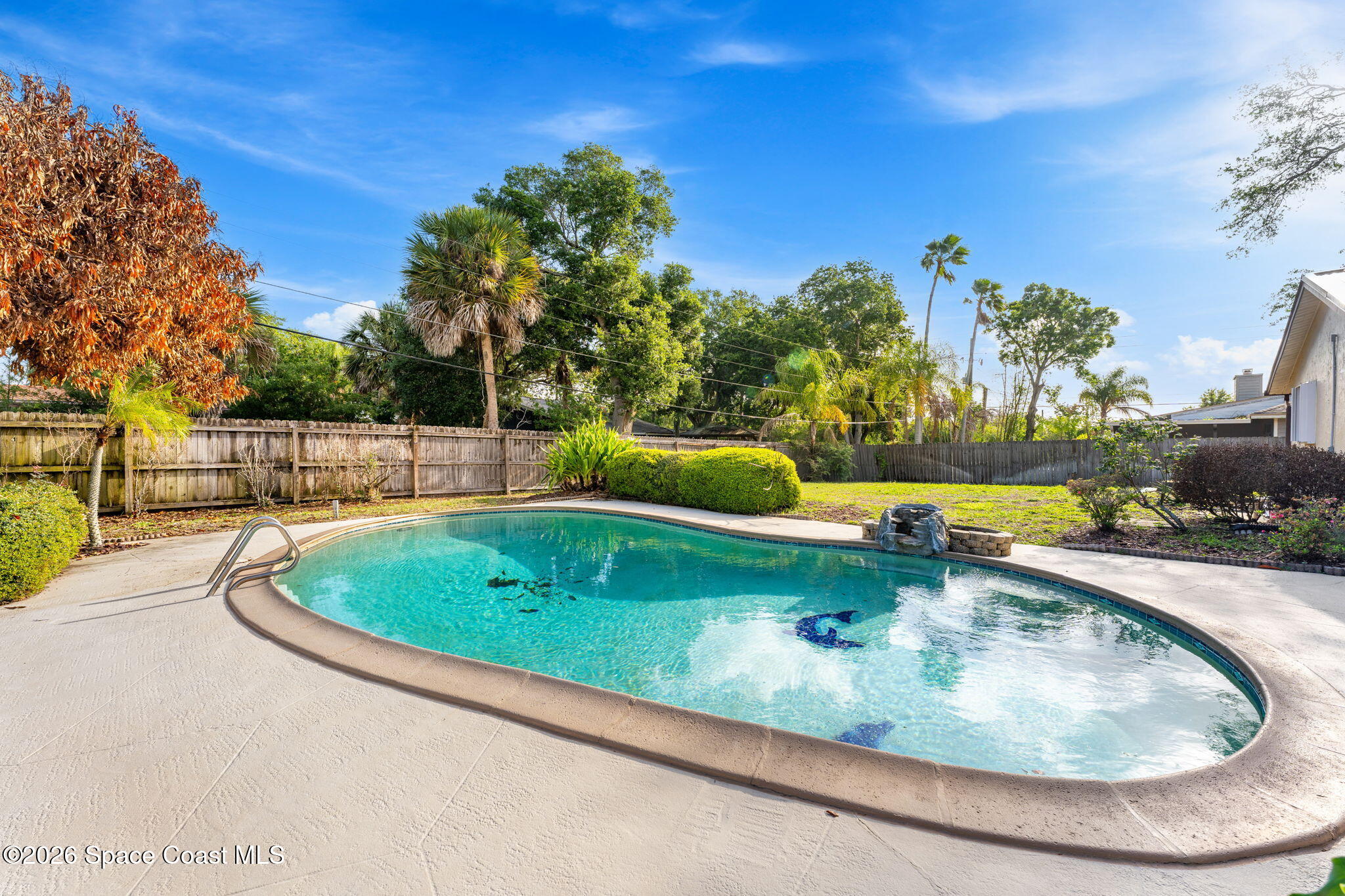 1310 St George Road Merritt Island, FL 32952 - Photo 48 of 59 a view of a swimming pool with a yard and plants