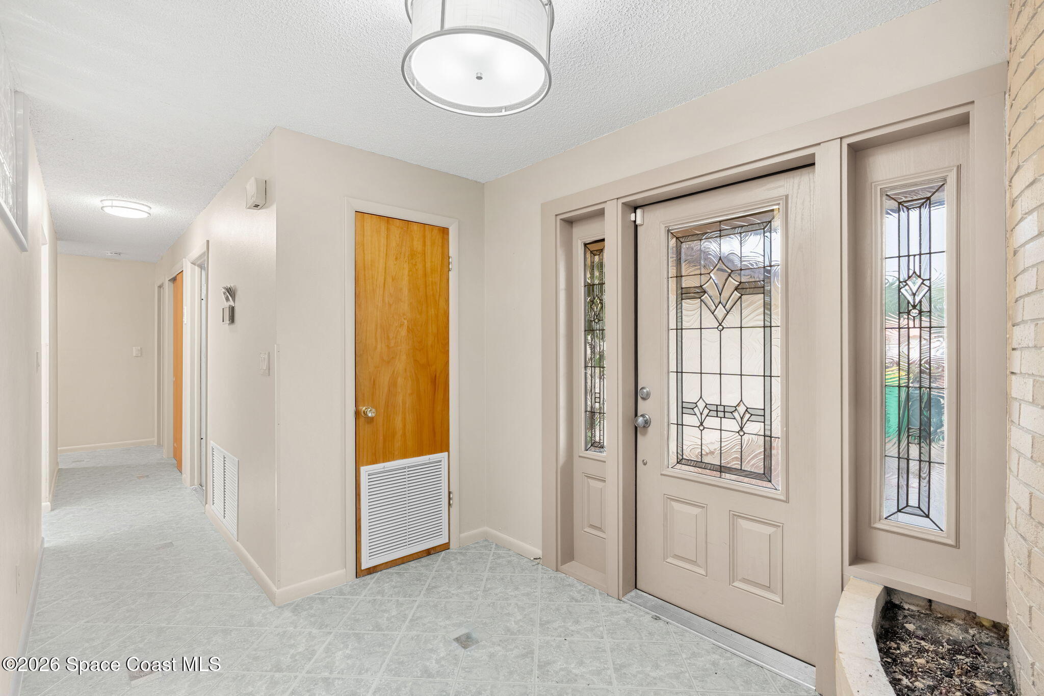 1310 St George Road Merritt Island, FL 32952 - Photo 8 of 59 a view of hallway with natural light