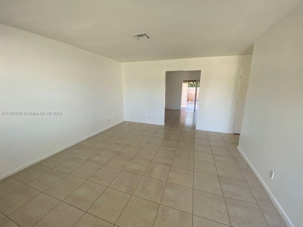 641 Silver Beach Road Riviera Beach, FL 33403 - Photo 11 of 13 a view of an empty room and window