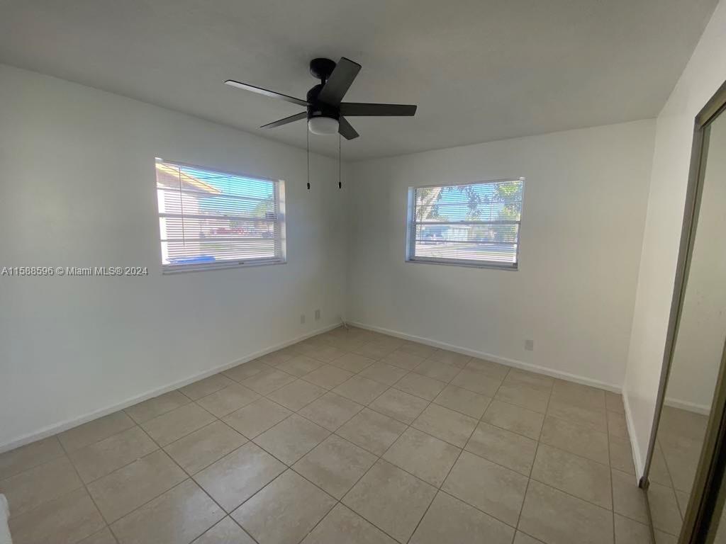 641 Silver Beach Road Riviera Beach, FL 33403 - Photo 7 of 13 a view of an empty room with a window