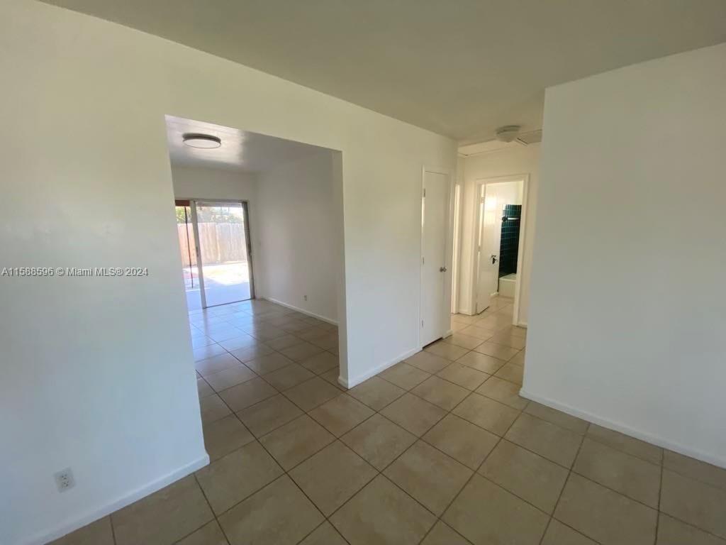 641 Silver Beach Road Riviera Beach, FL 33403 - Photo 10 of 13 a view of a hallway with wooden floor