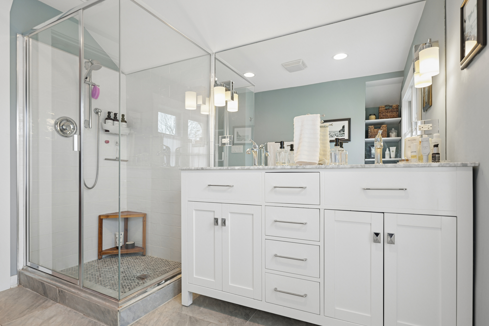 4136 Raymond Avenue Brookfield, IL 60513 - Photo 20 of 23 a bathroom with a granite countertop sink a mirror and shower