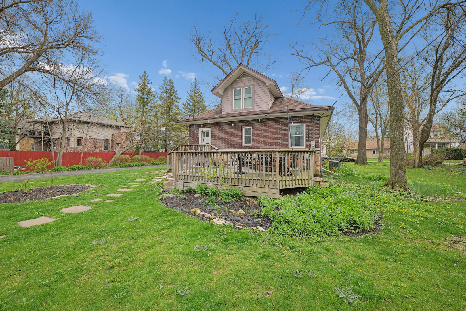 4136 Raymond Avenue Brookfield, IL 60513 - Photo 23 of 23 a view of a house with a big yard and large tree